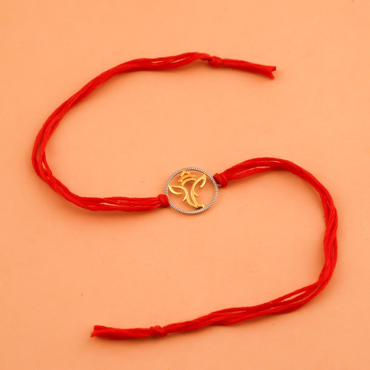 Silver Rakhi: Dual Tone Ganesha God Rakhi