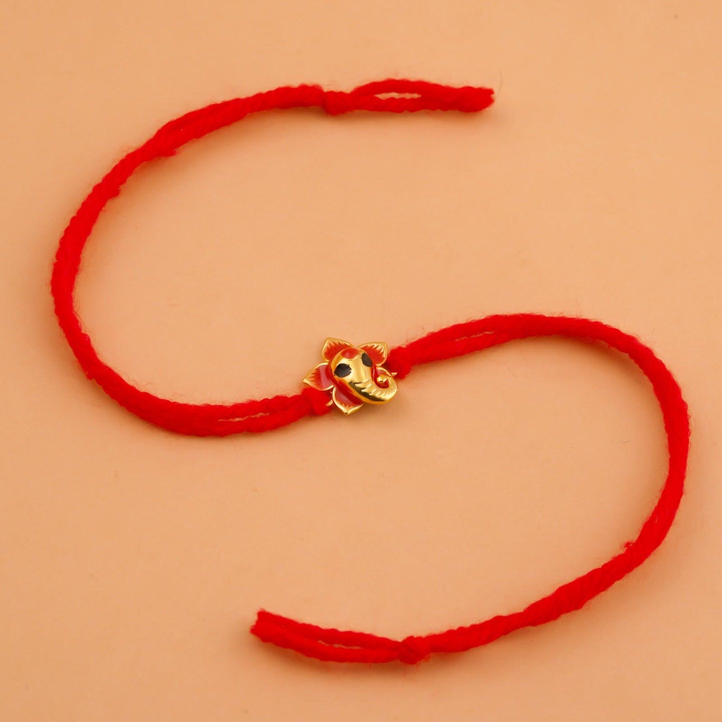 Silver Rakhi: Golden Lord Ganesha Rakhi