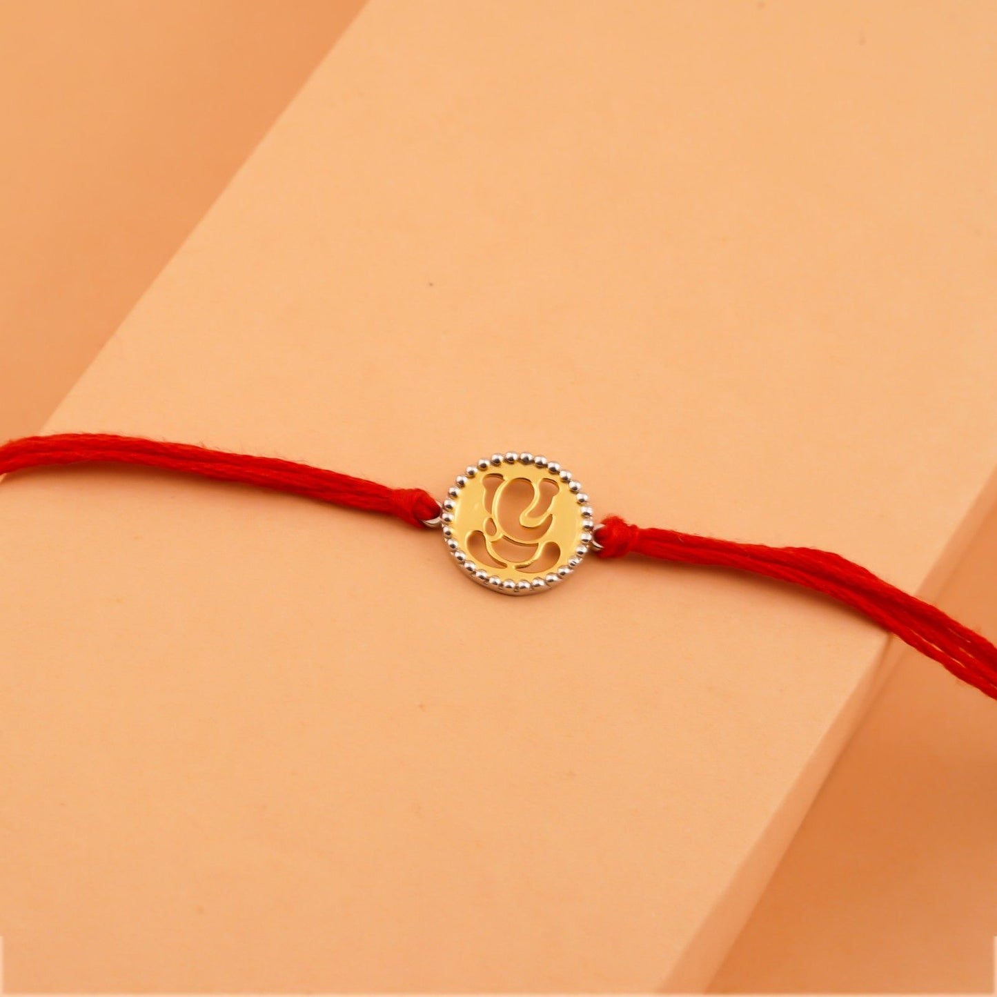 Silver Rakhi: Dual Tone Divine Ganesh Rakhi