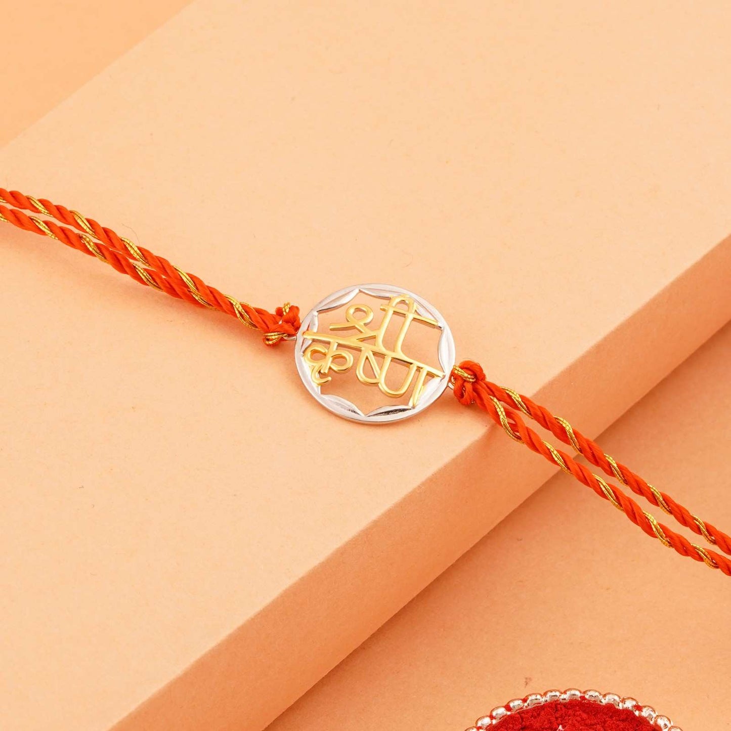 Silver Rakhi: Golden Sprial Shree Krishna Rakhi