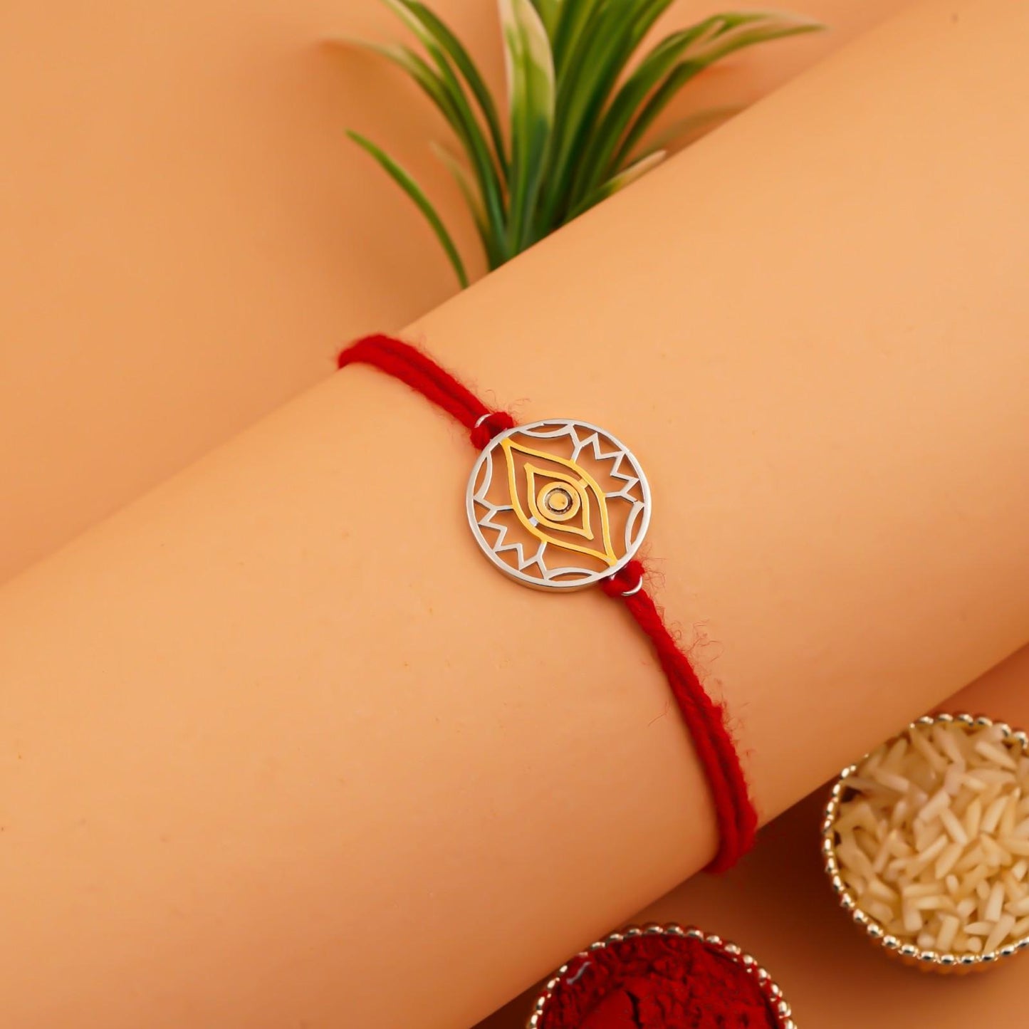 Silver Rakhi: Golden Evil Eye Protect Rakhi