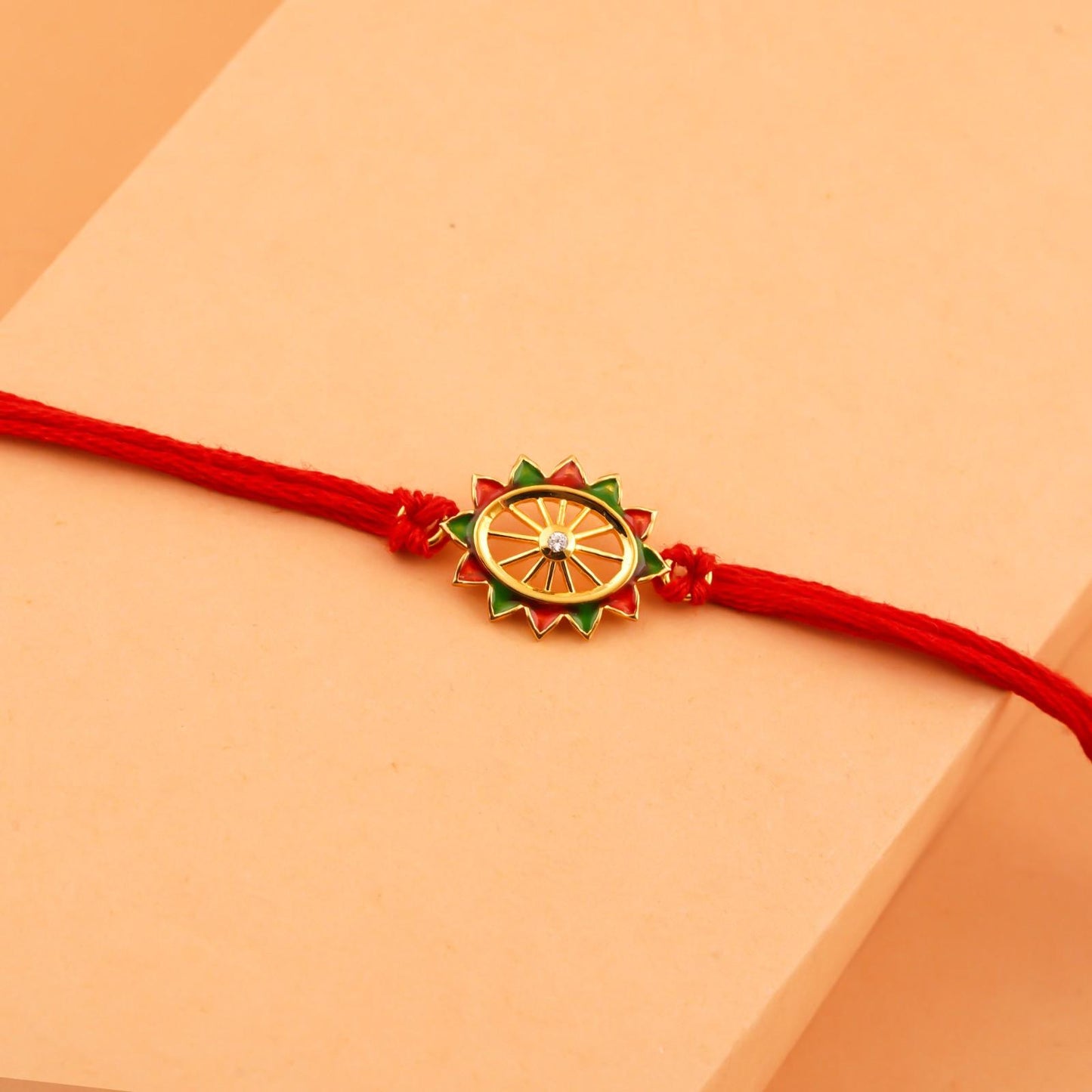 Silver Rakhi: Golden Pinwheel Enamel Rakhi