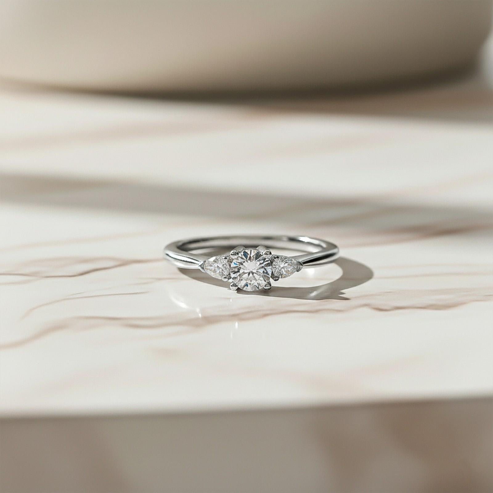 1Ct Moissanite Vega Round and Pear Trilogy Ring