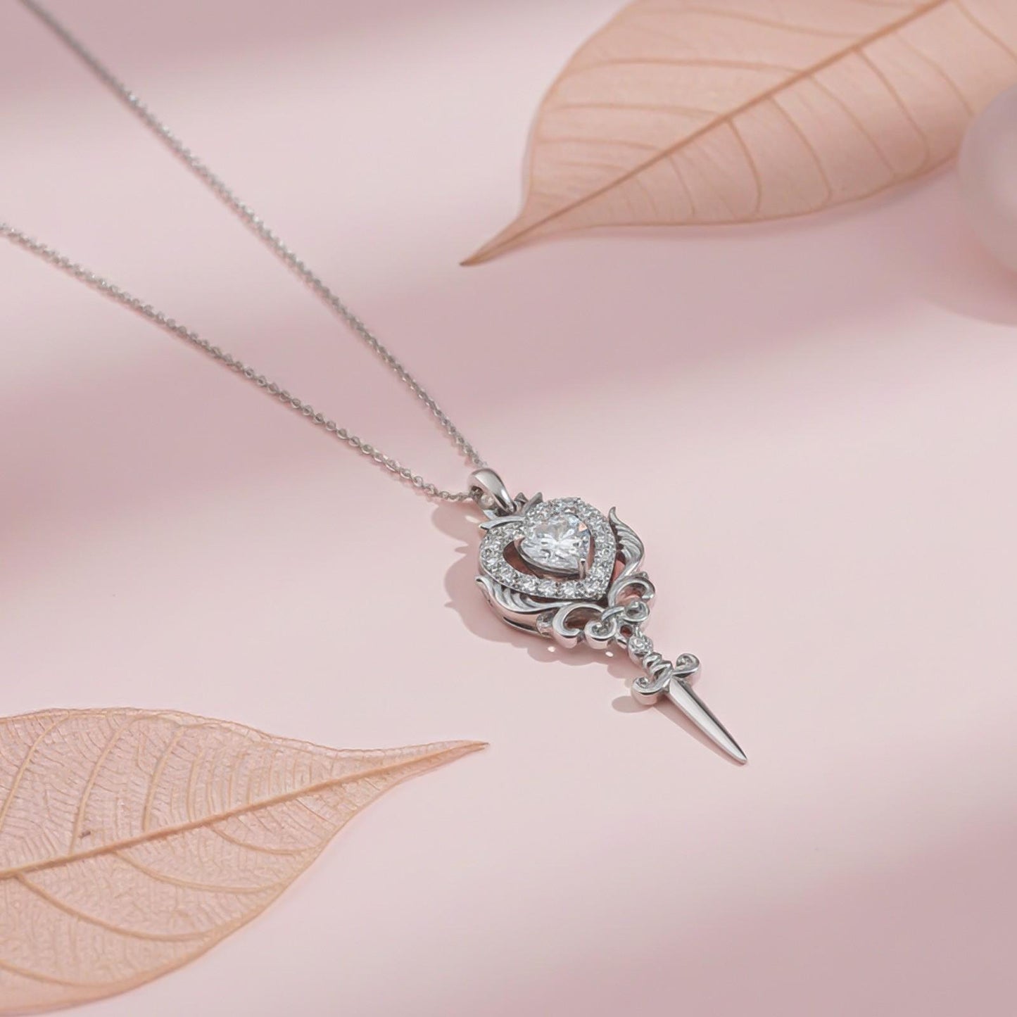 Silver Round Heart Weapon Pendant