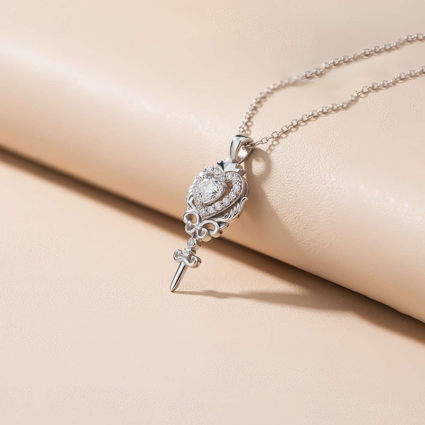 Silver Round Heart Weapon Pendant