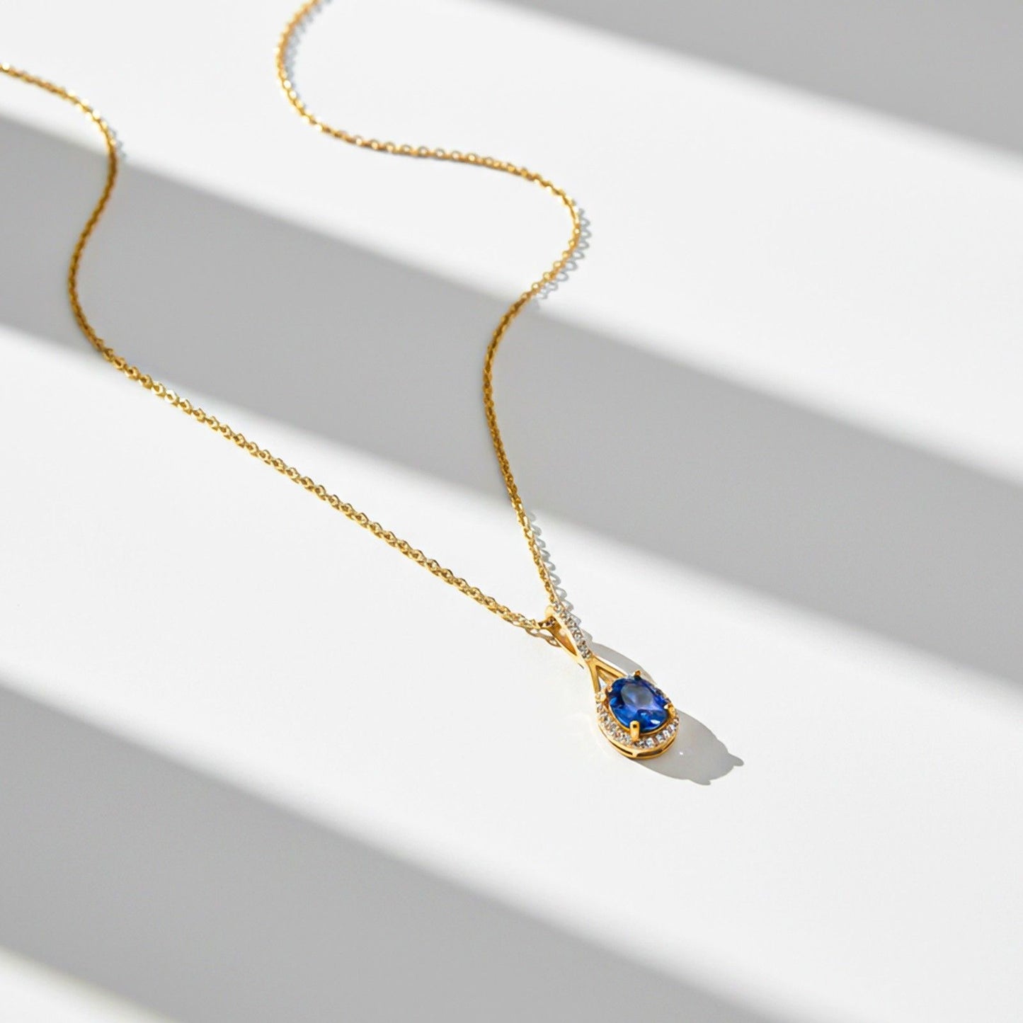 Golden Dazzling Halo Sapphire Pendant