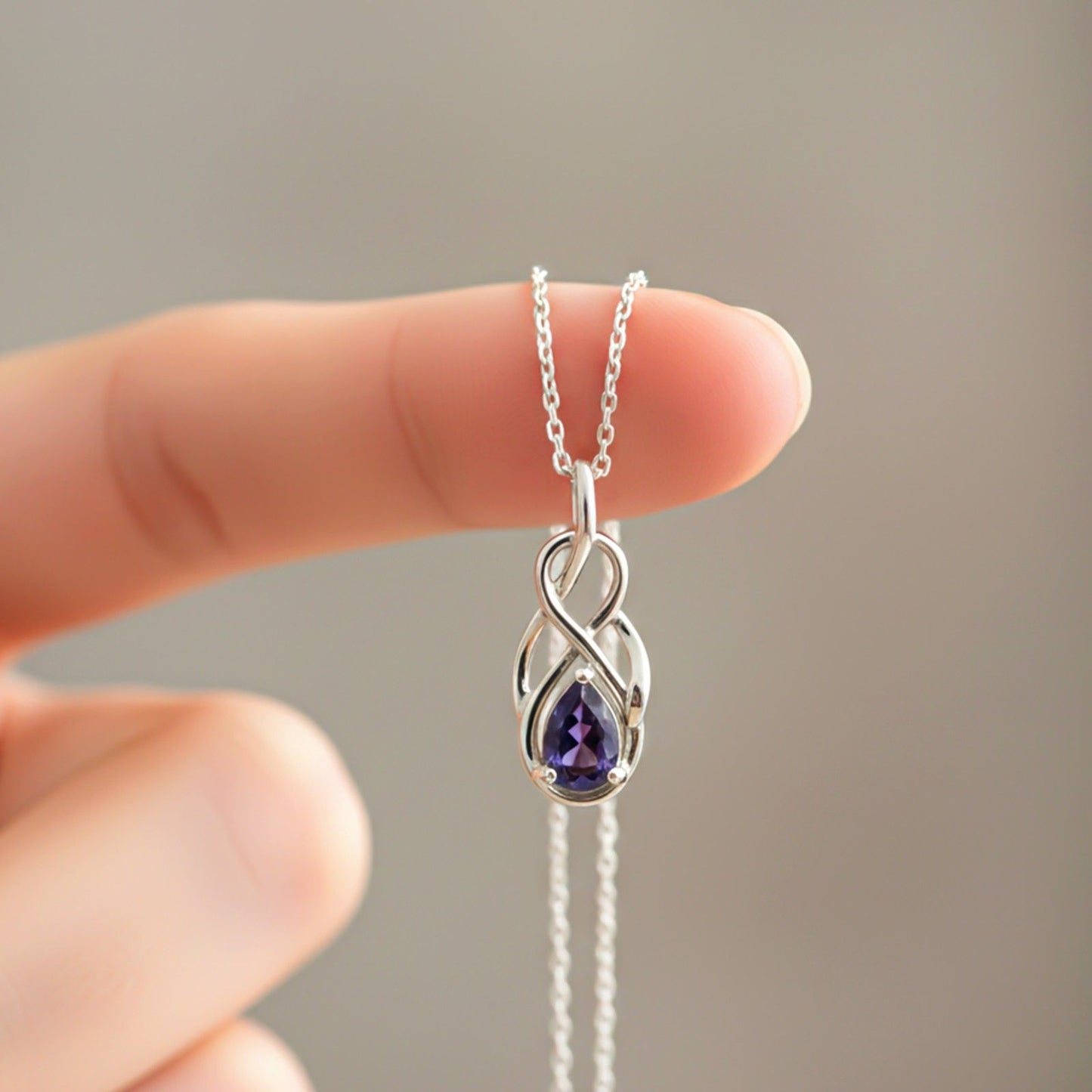 Silver Sapphire Infinity knot Pendant