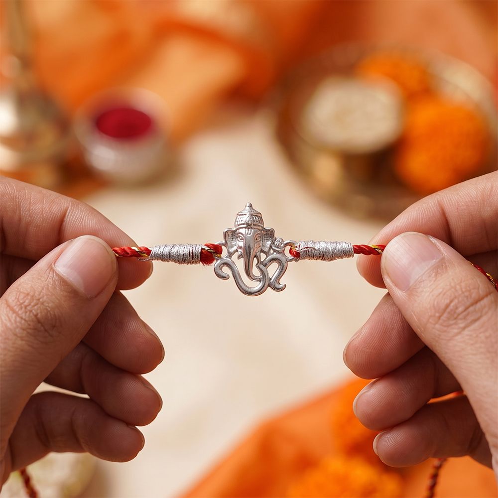 Silver OM Ganesh Face Rakhi