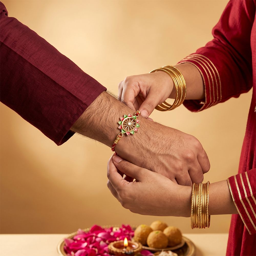 Golden Pinwheel Enamel Rakhi