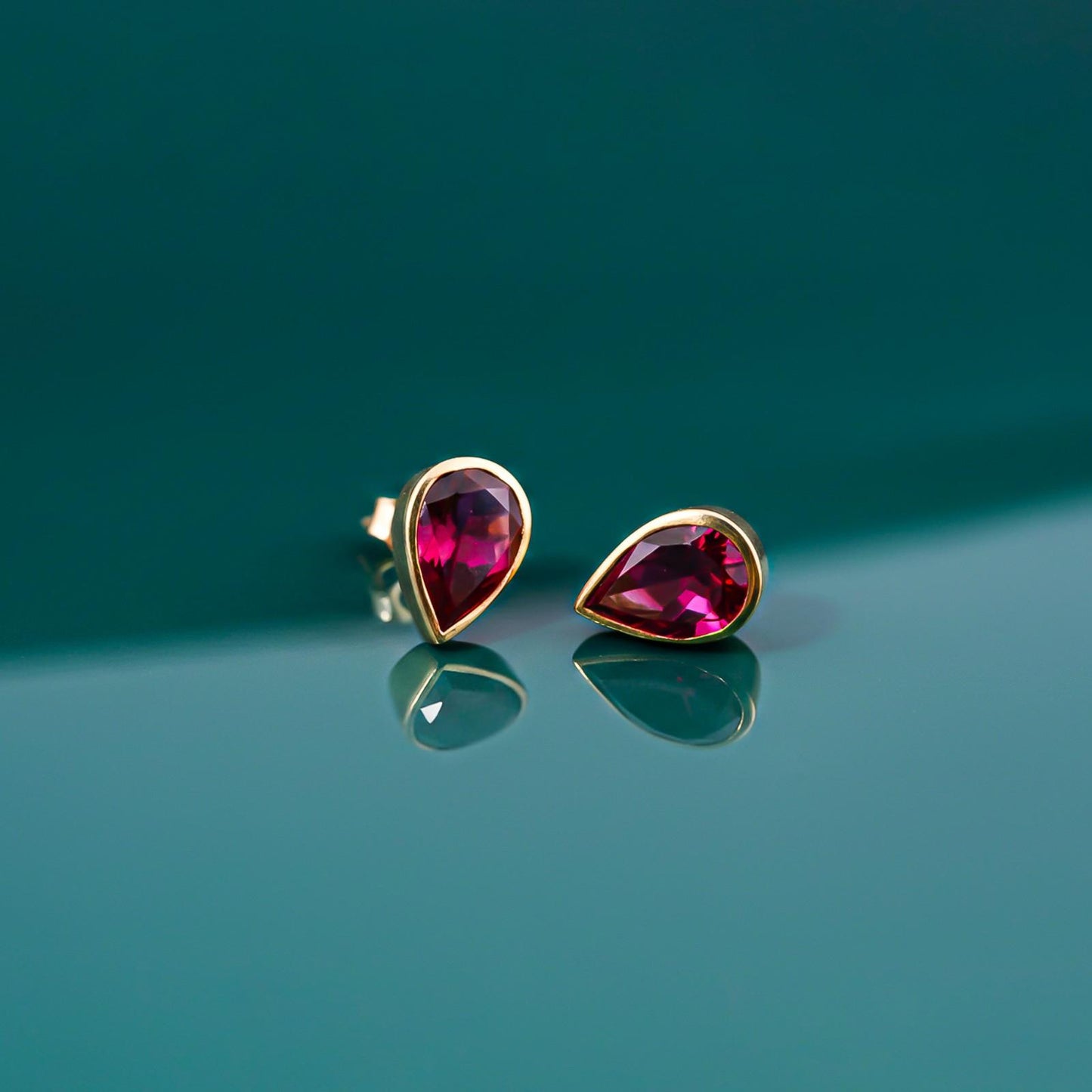 Golden Pear Shape Ruby Stud Earrings